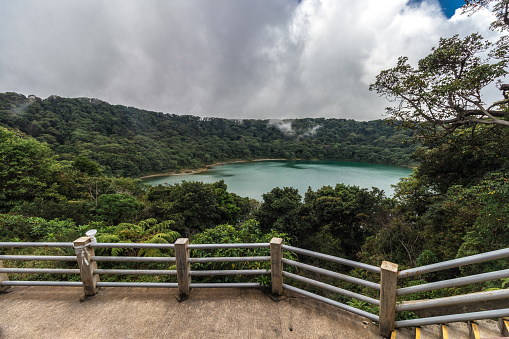 Botos Lagoon viewpoint turquoise acidic waters in the PoÃ¡s Volcano National Park in Costa Rica on a cloudy morning