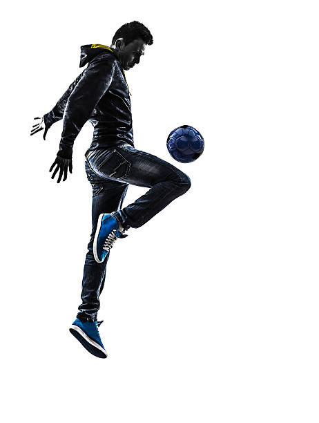 istock young man soccer freestyler player silhouette 180882126