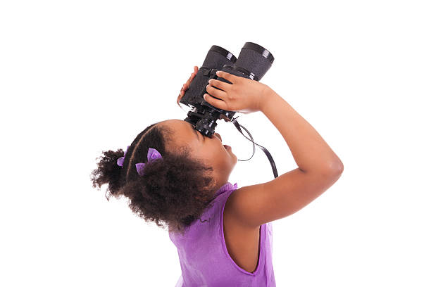 African little girl looking through binoculars isolated on a over white