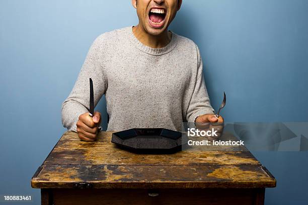 Hungry Young Man Is Screaming For His Dinner Stock Photo - Download Image Now - Hungry, Men, Anger