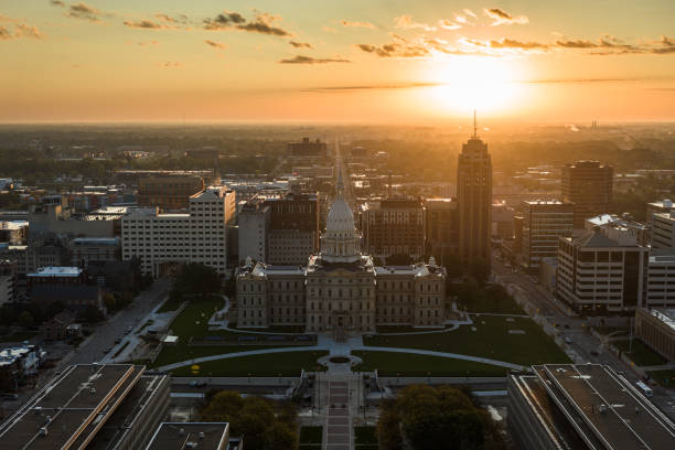 istock Sun Rising Behind Michigan State Capitol Building 1808836604