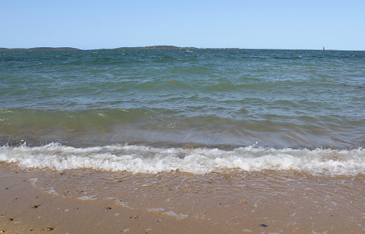 Ocean waves on a sandy beach