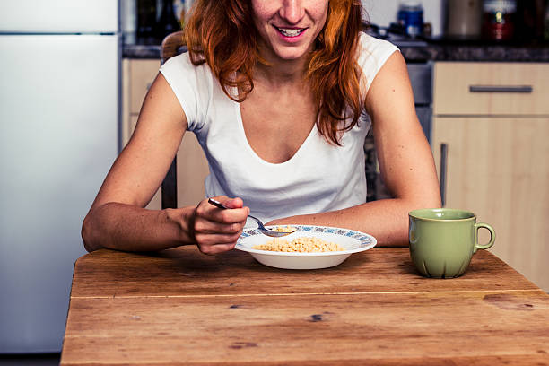 istock Happy woman having breakfast 180887008