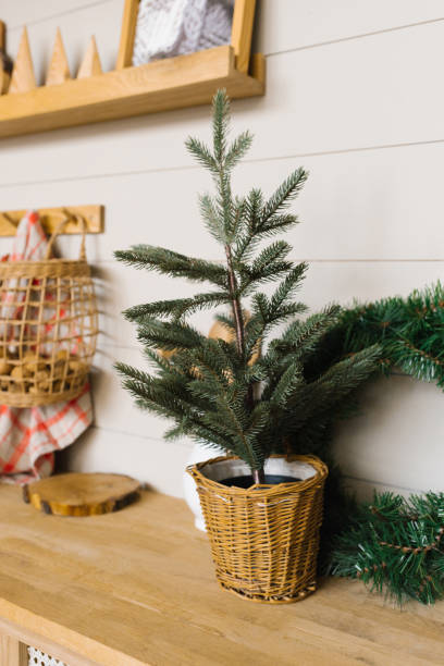 istock Christmas tree in a wicker pot in the Scandinavian kitchen 1808875296