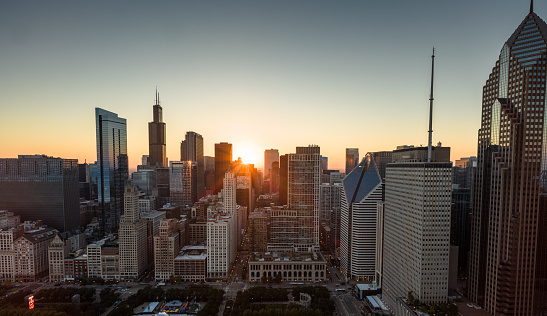 Aerial still image of downtown Chicago, Illinois on a clear sunset in Fall.