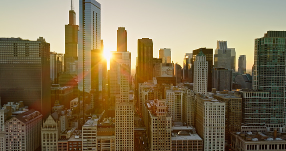 Aerial still image of downtown Chicago, Illinois during sunset on a clear day in Fall.