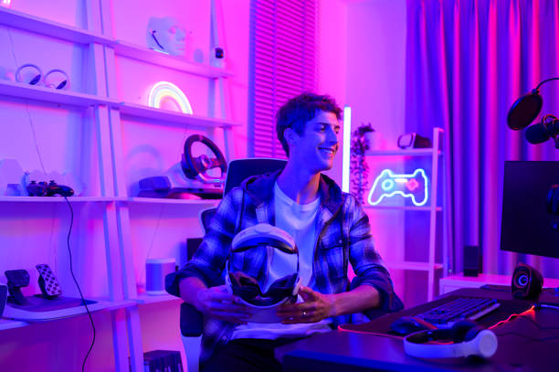 istock Young Caucasian man Pro Gamer have live streaming  playing video game,  using virtual reality glasses at home 1808882810