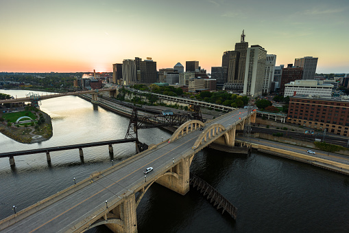Aerial still image of Robert Street Bridge with downtown St. Paul, Minnesota in the background on a clear sunset in Fall.\n\nAuthorization was obtained from the FAA for this operation in restricted airspace.