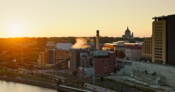 Aerial still image of downtown St. Paul, Minnesota with Cathedral of St. Paul visible in the distance at sunset.\n\nAuthorization was obtained from the FAA for this operation in restricted airspace.