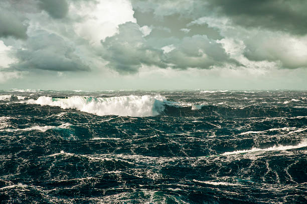 istock A wave crashing over a stormy sea 180889094