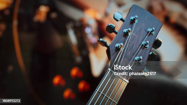 Closeup Of An Acoustic Guitar Stock Photo - Download Image Now - Acoustic Music, Adjusting, Arts Culture and Entertainment