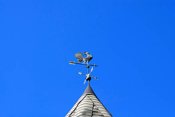 istock Rooster weathervane on sky 180893567