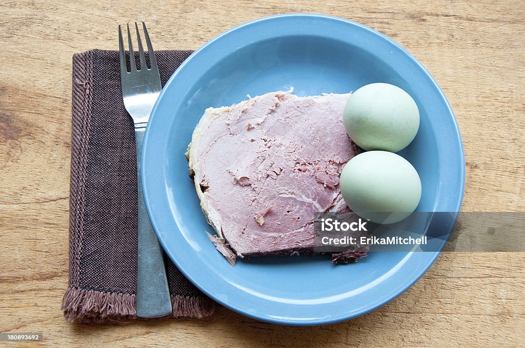 Green eggs and ham with fork, napkin A plate with a pair of green eggs and ham suggests the title of the Dr. Seuss book "Green Eggs and Ham". The naturally colored eggs are from araucana chickens. Theodor Seuss Geisel Stock Photo