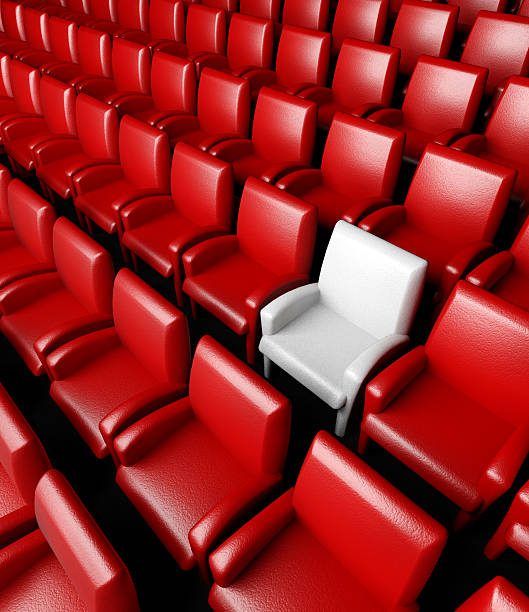 istock Empty cinema hall with auditorium and one reserved seat 180894200