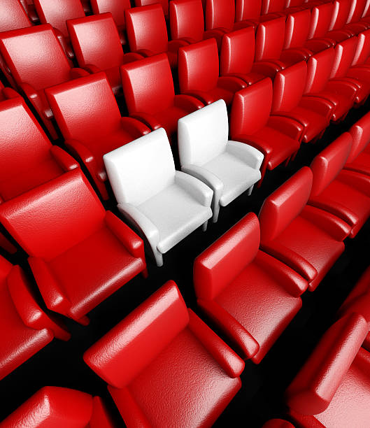 istock Empty cinema hall with auditorium and two reserved seat 180894232