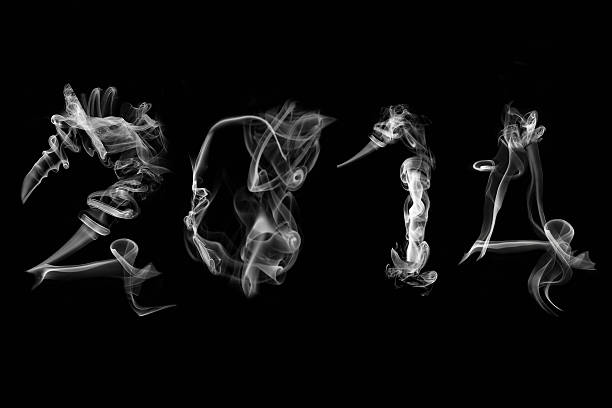 istock Year two thousand fourteen text made smoke. 180894241