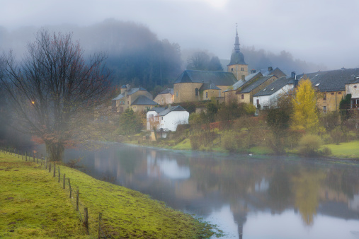 Fog hanging over the Semois river at Chassepierre village in the Gaume region of the belgian ardennes