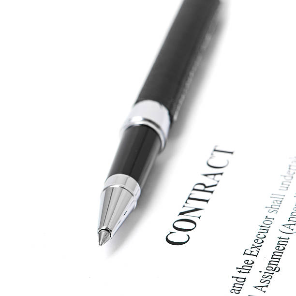 istock Close-up of silver pen on contract. 180897743