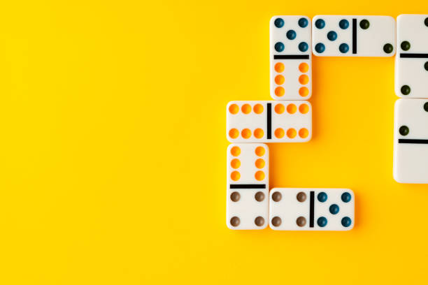 istock Domino tiles on yellow background studio shot 1808992567