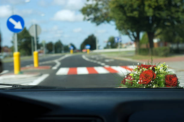istock Car wedding flower bouquet and road 180900365