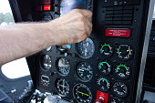 Helicopter cockpit. Control panels of a modern helicopter. The pilot is making final adjustments for takeoff.