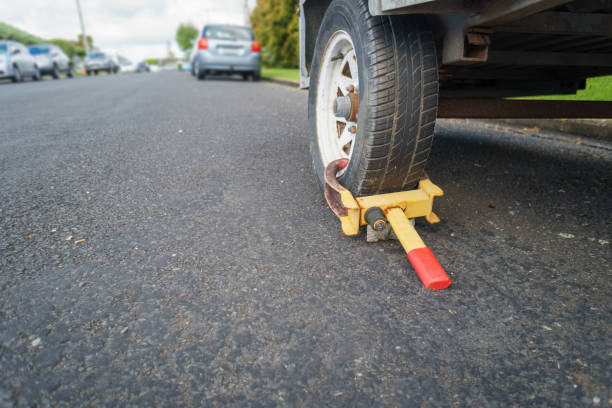 istock Wheel clamp anti-theft lock placed on a truck wheel 1809024219