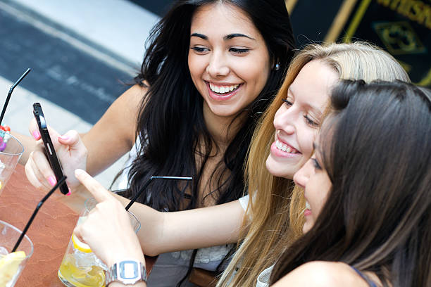istock Friends having fun with smartphones 180903617