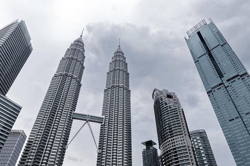 Kuala Lumpur, Malaysia - November 25, 2019: Kuala Lumpur City view with skyscrapers under cloudy sky