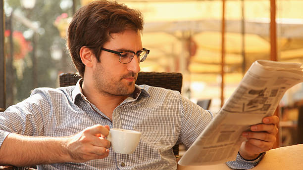 istock Young man enjoying in cafe 180903852
