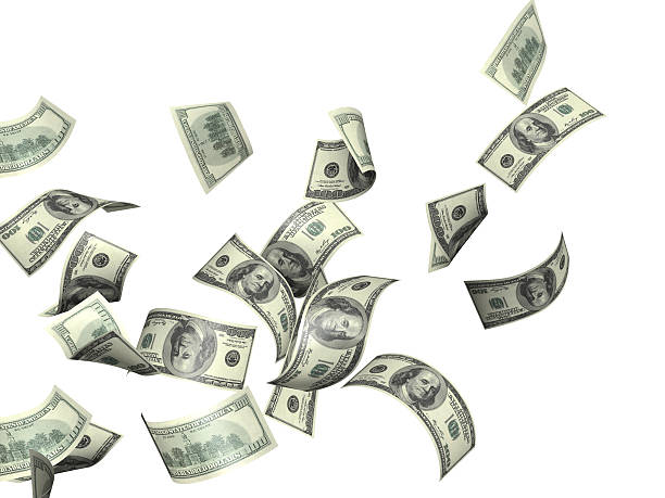 istock A closeup of money blowing away 180904810