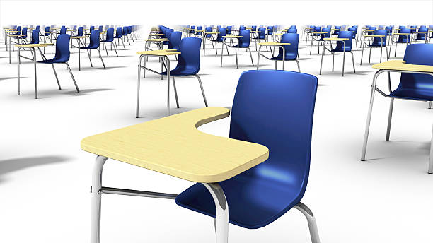 Angled close-up view of endless school chairs. stock photo