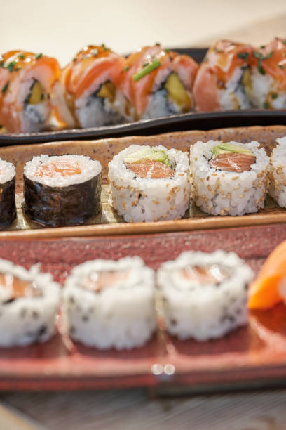istock Delicious set of sushi on ceramic trays 1809053325