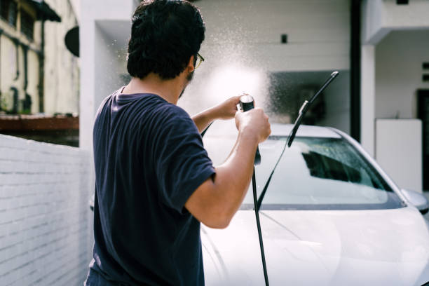 istock Close Up Man Washing Car Using Water Jet 1809063177