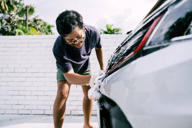 Young Man Cleaning His Car with Soap, Car Washing