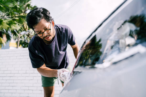 istock Young Man Cleaning His Car with Soap, Car Washing 1809064767