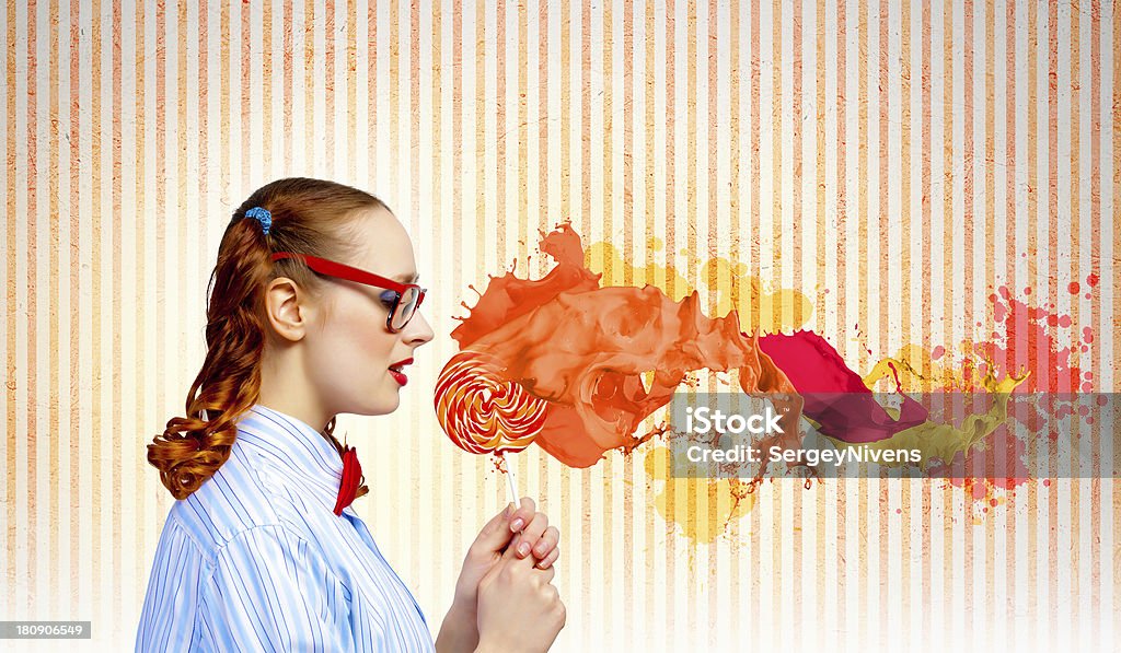 Funny girl with lollipop Image of funny lady in red glasses with lollipop Adult Stock Photo