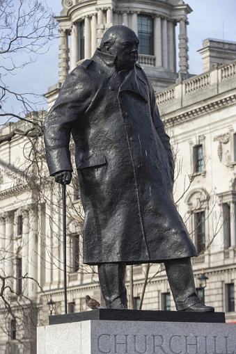 London, United Kingdom - February 10, 2023: bronze statue of the former British prime minister Winston Churchill on Parliament Square. It was created by Ivor Roberts-Jones and unveiled in 1973