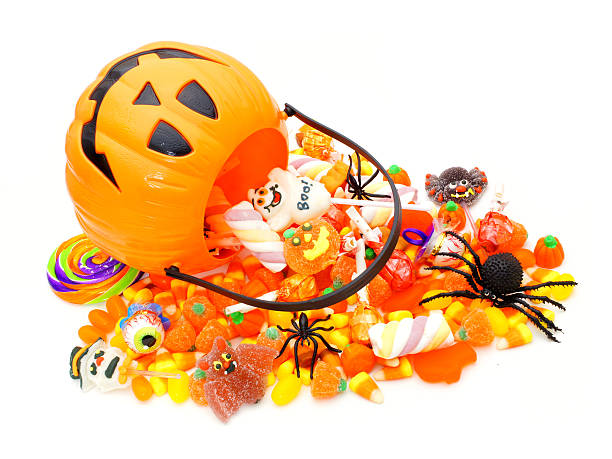 istock Halloween Jack o Lantern pail with spilling candy 180907457