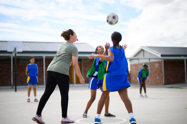 istock Full length shot coach whistles to start netball game 1809082983