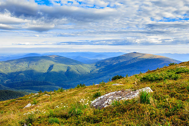 istock mountain panorama with large rock on the hillside 180909947