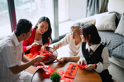 Asian Chinese family preparing before Chinese New Year.