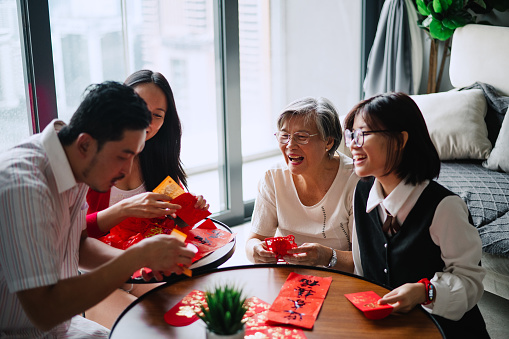 Asian Chinese family preparing before Chinese New Year.