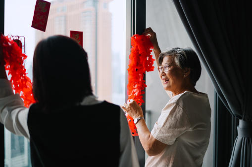 Asian Chinese family preparing before Chinese New Year.