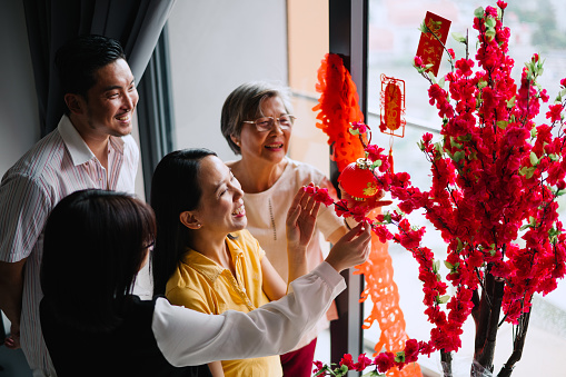 Asian Chinese family preparing before Chinese New Year.