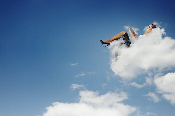 istock Businesswoman lying on clouds 180910608