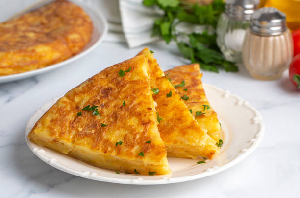 istock Spanish omelette with potatoes, typical spanish cuisine on gray concrete floor. Tortilla Espanola. Turkish name; Yumurtali patates 1809106779