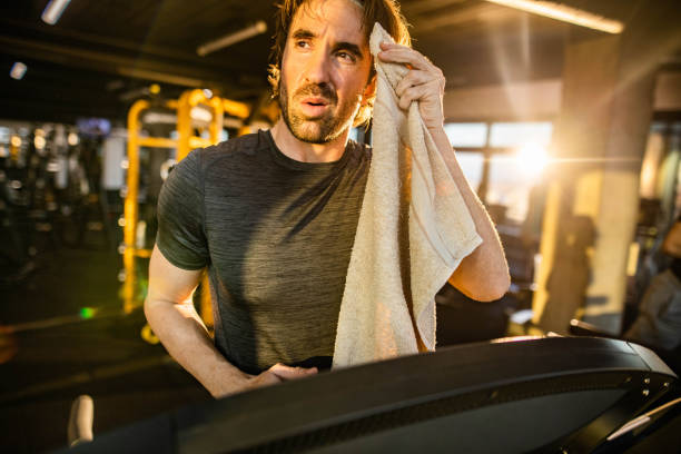 istock Athletic man feeling tired on sports training in a gym. 1809106787