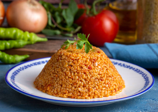 istock Traditional turkish bulgur pilaf with tomato sause in plate (Turkish name; meyhane pilavi) 1809109933