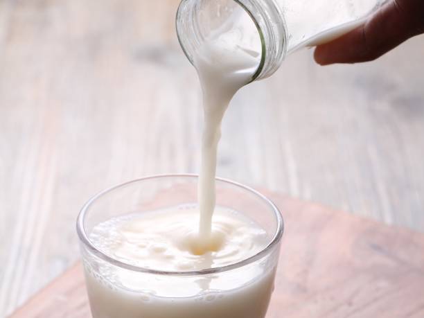 istock fresh milk in clear glass on the table 1809144089