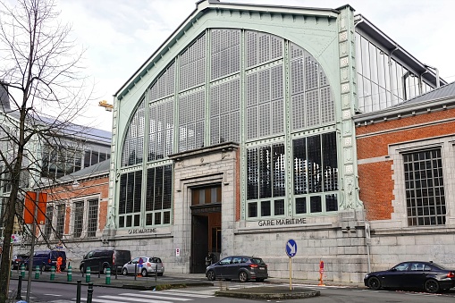 Brussels, Belgium – November 17, 2023: The entrance on the fully renewed historical Gare Martime railway station in the Tour and Taxis area of Brussels